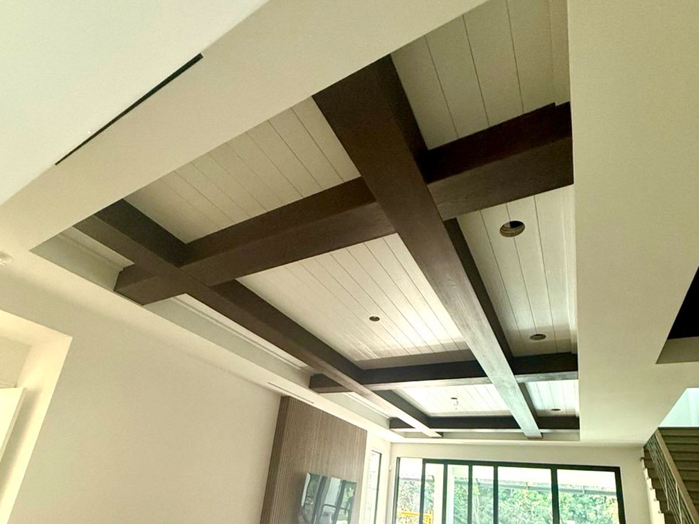 custom beams and tongue and groove ceiling installed in luxury home